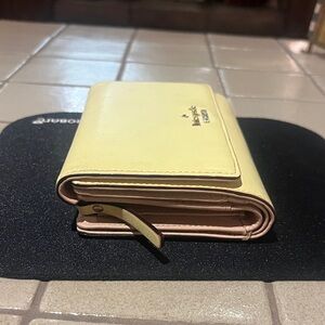Kate spade Pale Yellow Leather Fold Wallet with Gold Logo